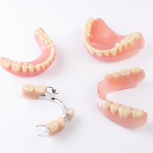 Various types of dentures with white background