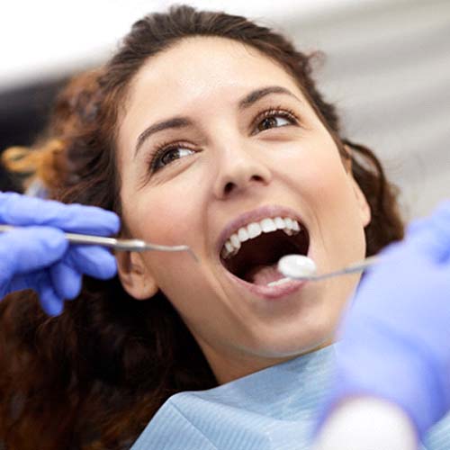 Woman visiting an emergency dentist in Willowbrook for a checkup