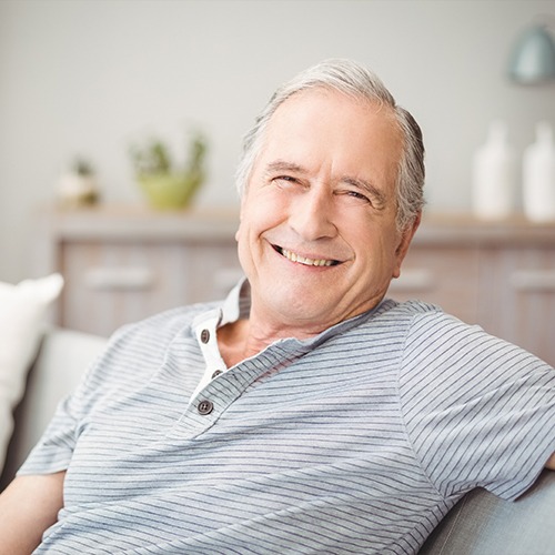 Man smiling after E four D one visit dental restoration