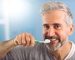 Man brushing teeth in Willowbrook